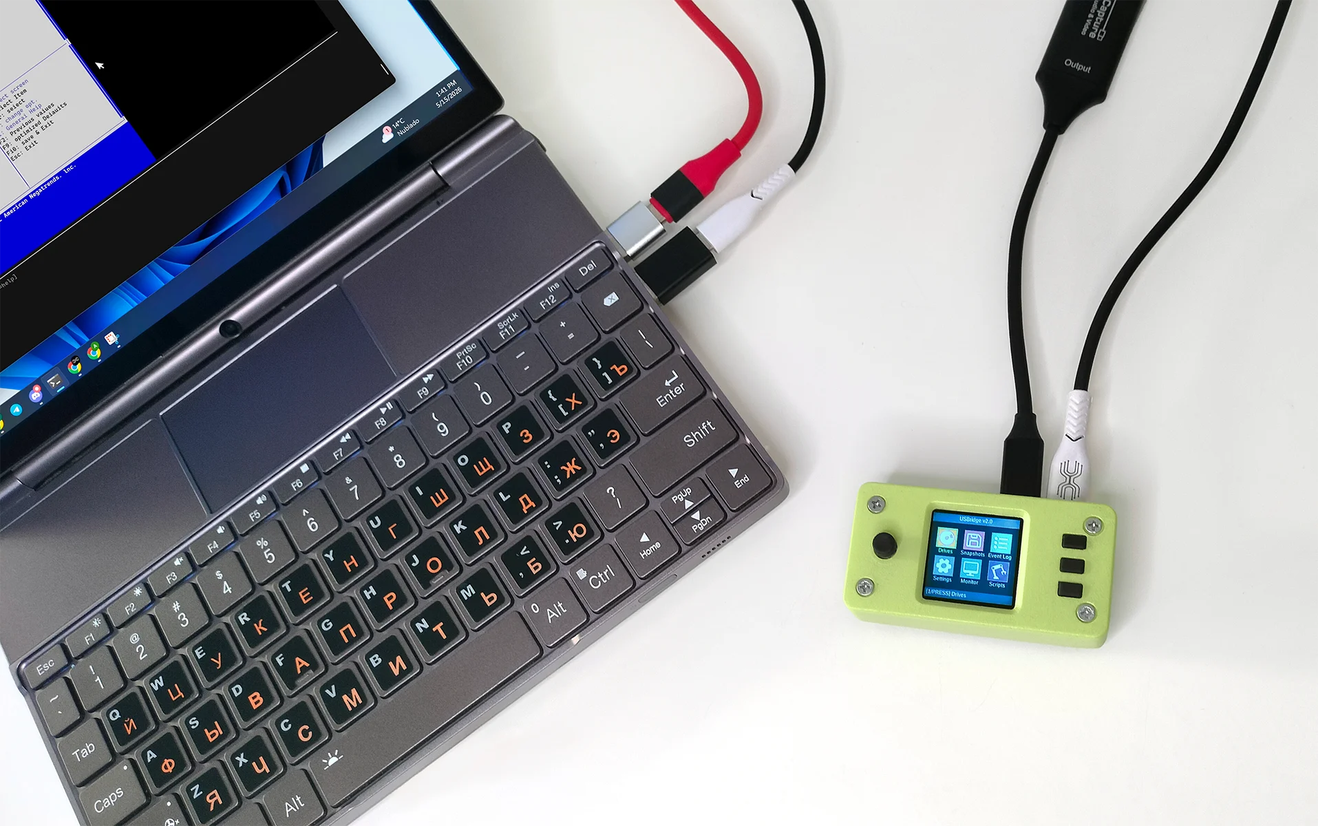 Cinematic close-up of USBridge KVM 2.0 devices in Pistachio Green and Arctic White colors, showcasing compact design and integrated displays.